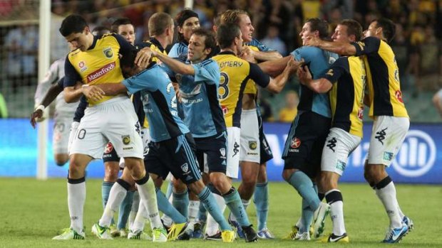 Sydney FC and Central Coast Mariners players get to grips with each other last season.