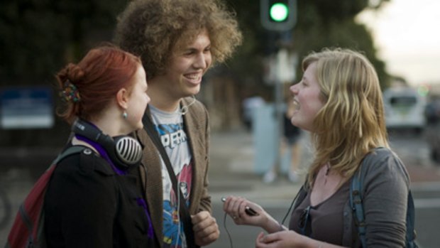 They buy CDs to get music for their iPods ...  Freya Berkhout, 19, Michael Moore, 20, and Isabel Wheeler, 19, outside the University of Sydney yesterday.