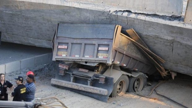 A truck is pinned underneath the collapsed bridge in Belo Horizonte.