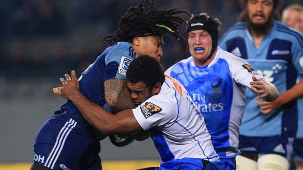Dropping the shoulder ... Ma'a Nonu charges into the Force's Napolioni Nalaga.