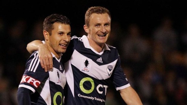 Melbourne Victory’s Kosta Barbarouses (left) and new signing Besart Berisha.