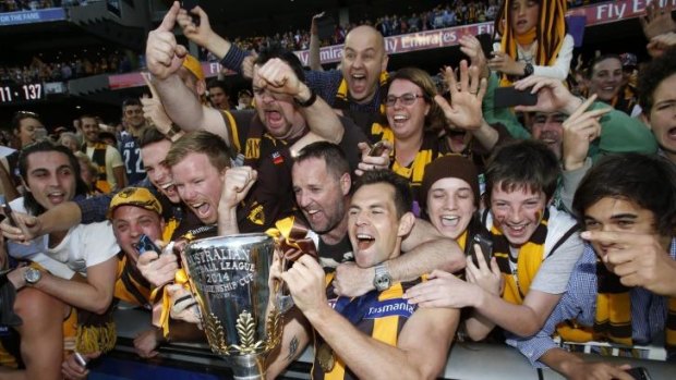 Sharing the spoils: Luke Hodge with the premiership cup.