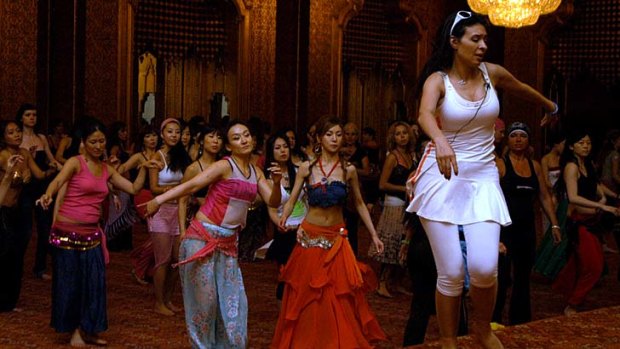 In demand: Belly dancer Dina gives a lesson in Cairo during an international contest.