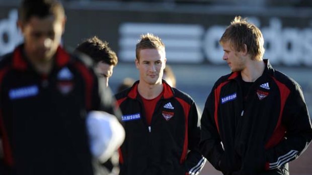 Essendon's Jason Winderlich and Michael Hurley during recovery.