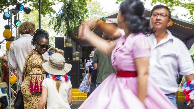 Esther Khakula and Emily Joehnk Escobar, 6, dance together at the festival.