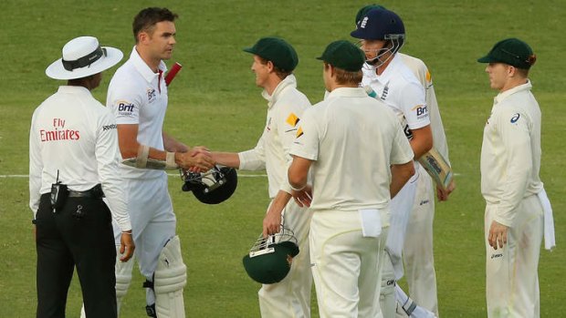 George Bailey and England batsman James Anderson shake after earlier exchanging words.