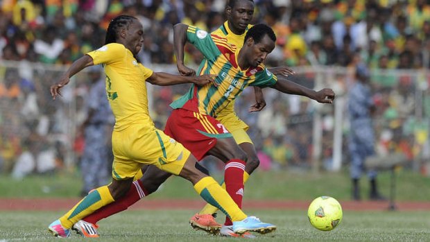 Going through? ... South Africa's Reneilwe Letsholonyare (left) and Erick Mathoho (centre) vie for the ball with Ethiopia's Salahidin Said during Sunday's qualifier. Ethiopia are in trouble for fielding a disqualified player in an earlier match against Botswana.