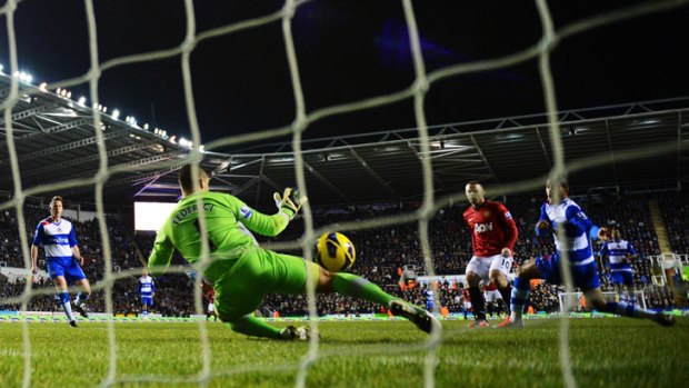 Goal feast... Wayne Rooney scores for Manchester United in their 4-3 win at Reading.