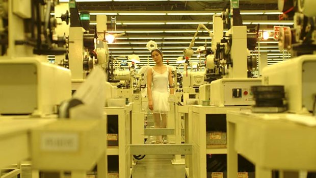A still from Cao Fei's <i>Whose Utopia</i>, filmed in a Chinese light globe factory.