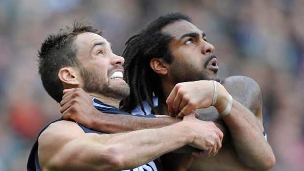 Gripping: Carlton's Andrew Walker battles with Collingwood's Harry O'Brien.