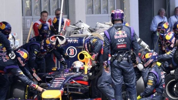 Sebastian Vettel gets some pit-stop assistance during the Austrian F1 Grand Prix