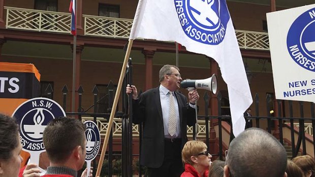 WorkCover reform ... protesters rally outside NSW Parliament today.