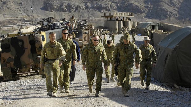 Tour of duty … Cantwell (centre) is briefed while at Patrol Base Qudus, in Afghanistan’s Uruzgan province, in 2010.