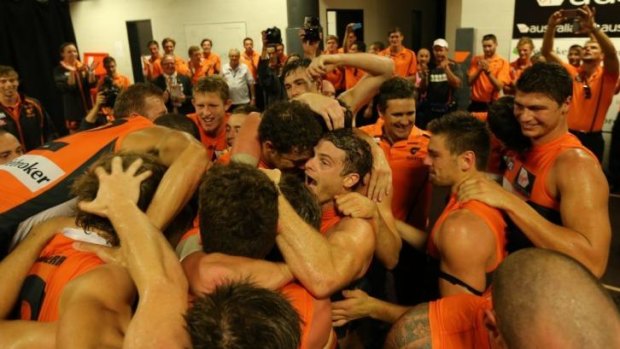 GWS Giants celebrate their first win over the Swans