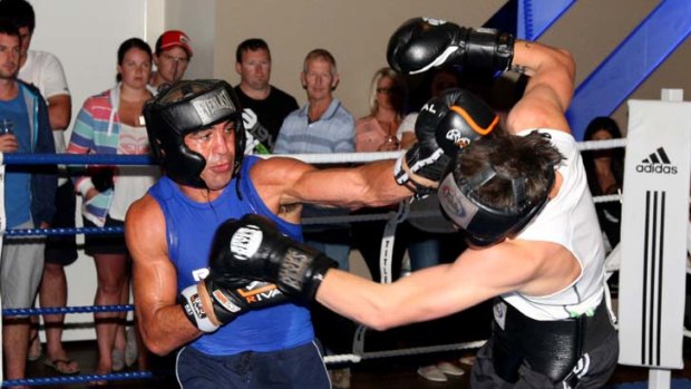 Trading blows &#8230; Sam Soliman, in blue, goes through the paces with Shane Carlin.