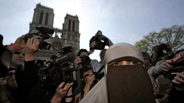 Kenza Drider, a French Muslim of North African descent, wears a niqab outside the Notre Dame Cathedral in Paris just before the ban on veils came into effect.