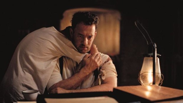 Tom Hanks says very little as a man trying to avenge the murder of his family and protect his son played by Tyler Hoechlin in Sam Mendes' film <i>Road To Perdition</i>.
