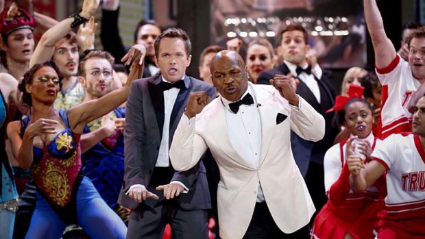 Tony awards: Host Neil Patrick Harris (centre left) and retired boxer Mike Tyson (centre right) perform during the opening number.