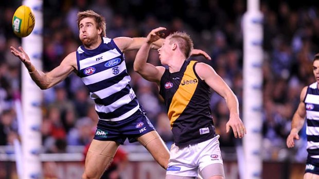 Geelong's Tom Lonergan and Richmond's Jack Riewoldt vie for possession.