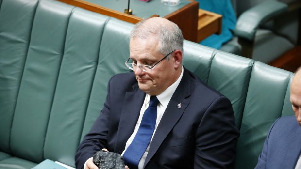 Treasurer Scott Morrison with a lump of coal during Question Time.
