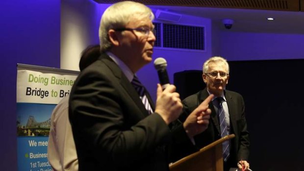 Prime Minister Kevin Rudd with LNP candidate Dr Bill Glasson at a candidates debate for Mr Rudd's seat of Griffith.