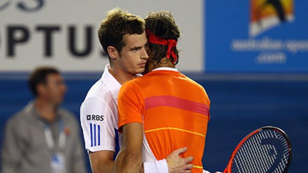 All over too soon ... Andy Murray embraces the injured Nadal after he retired in the third set of a brutal game.