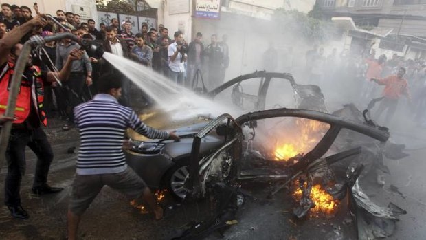 Self-defence or opening the gates of hell ... the scene after an Israeli air strike killed  Hamas's top commander Ahmed al-Jabari in Gaza City last week.