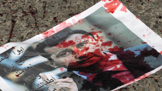 A bloody leaflet depicting Syrian President Bashar al-Assad.