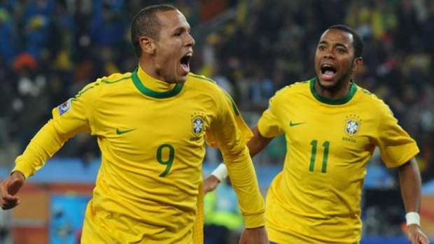 Goal hero ... Brazil striker Luis Fabiano, left, celebrates with Robinho after scoring.