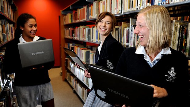 Melbourne Girls Grammar year 12 student Phoebe Cooke (right) talks about juggling Facebook and study with fellow-students Sarah Afriyie-Agyemang (left) and Gaby Karakas.