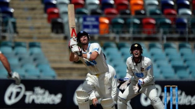 Steve Smith skies a delivery and is caught by Jason Behrendorff off the bowling of Ashton Agar.