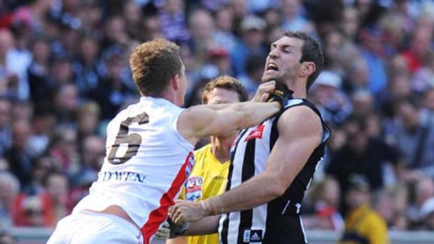 Zac Dawson and Travis Cloke wrestle before the first bounce.