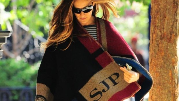Sarah Jessica Parker does Normcore in a monogrammed Burberry Prorsum blanket cape.