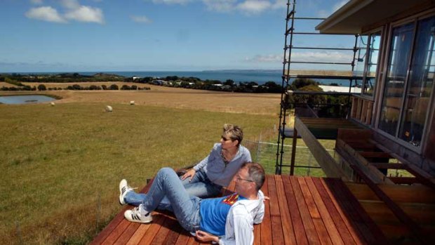 Robert Newall and Karen Green at their house under construction in Ventnor overlooking the proposed development site.