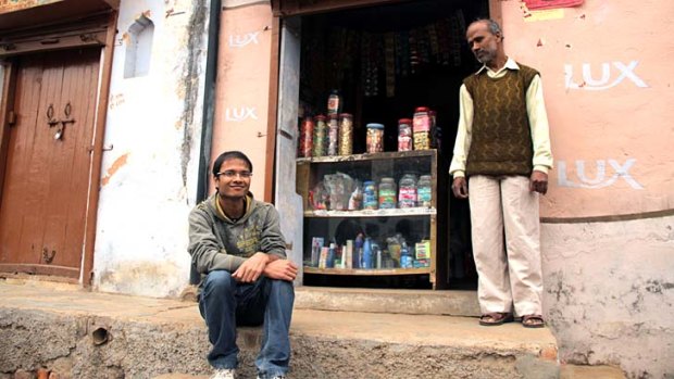 Self-driven: Student Uttam Kumar with his father, storekeeper Trilok Chand Mittal.