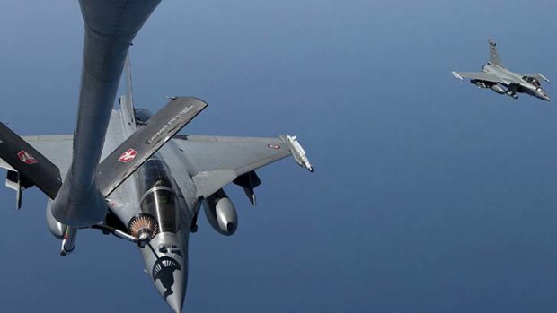Rafale jets fly back to Corsica after taking part in military operations in Libya.