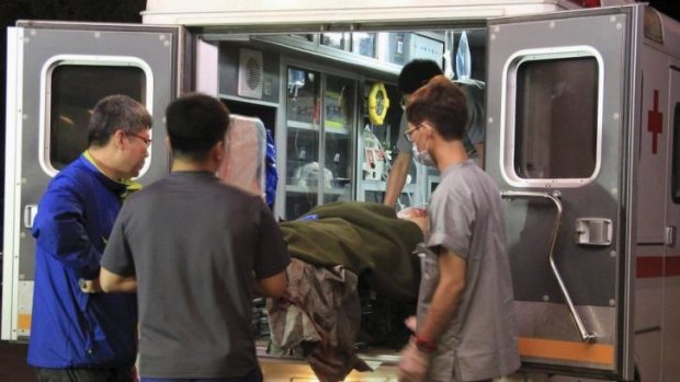 A wounded soldier is carried from an ambulance to a hospital in Gangneung, South Korea. 
