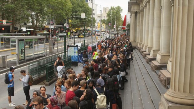 The queue snakes down Elizabeth Street prior to the official opening of H&M in Melbourne.
