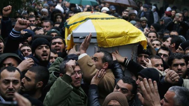 Outrage: Lebanon's Hezbollah members and relatives carry the coffin of Hassan al-Laqqis.