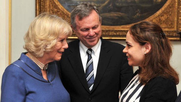 Britain's Camilla, Duchess of Cornwall talks with Rebecca Richards watched by Australian High Commissioner to London Mike Rann during a reception at Clarence House.