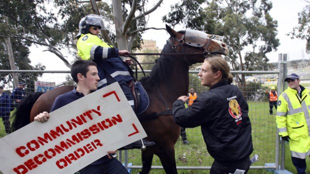 Police block protesters from entering the Hazelwood coal-fired power station, amid a demonstration against high-polluting brown coal.