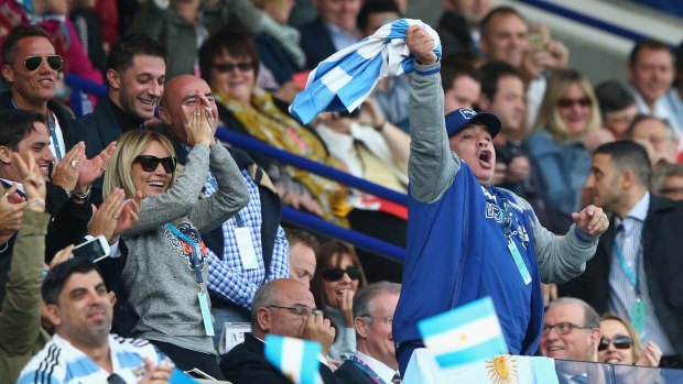Ambush marketing or support:  Diego Maradona celebrates in the stands.