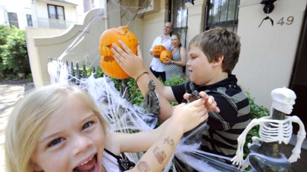 It's a scream... Juliet and Dan Toomey with Ashley, 10, and Lola, 5, in Paddington.