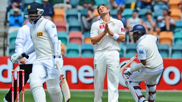 Shane Watson watches on the final day in Hobart as Sri Lankan batsmen Angelo Mathews and Thilan Samaraweera take a single.