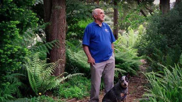 Feeling right at home: Kevin Heinze at ease in his garden with loyal companion Sally.