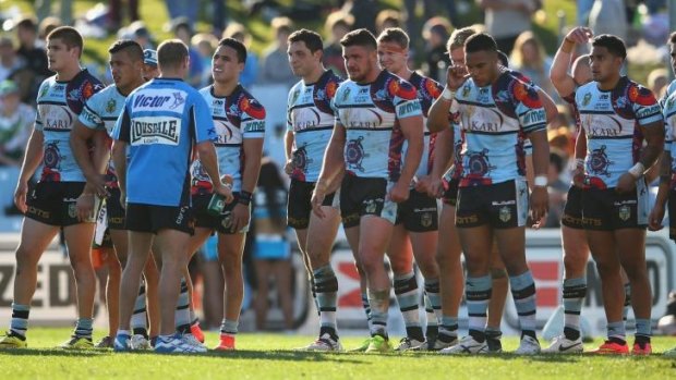 Tough times: Sharks players trying to regroup after conceding a try in their loss to Canberra.