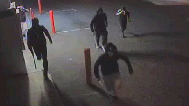 Armed with baseball bats and hockey sticks, a group of 10 men attacked four teenagers in a Warnbro parking lot.