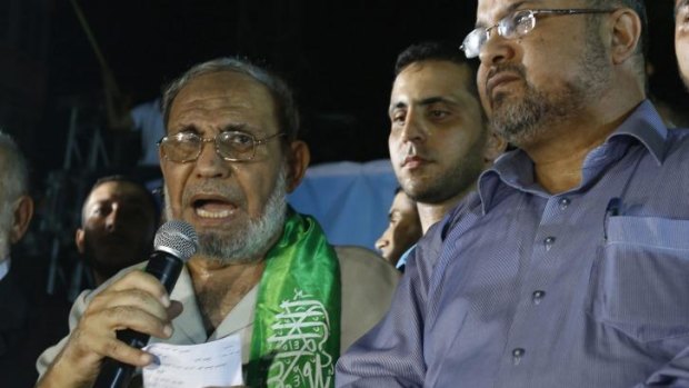 Senior Hamas leader Mahmoud Al-Zahar (left), appears for the first time since the start of the seven-week conflict at a celebration rally in Gaza.