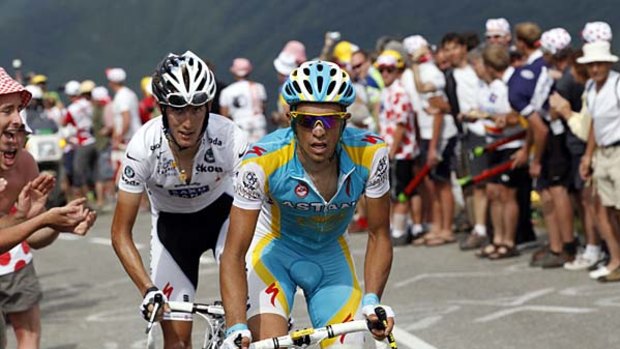 Race in two  . . . Andy Schleck (L) and Alberto Contador power up the final climb in the Alps.