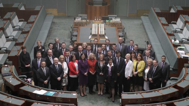 Learning the ropes: New members of the House of Representatives pose for a photograph in the chamber.
